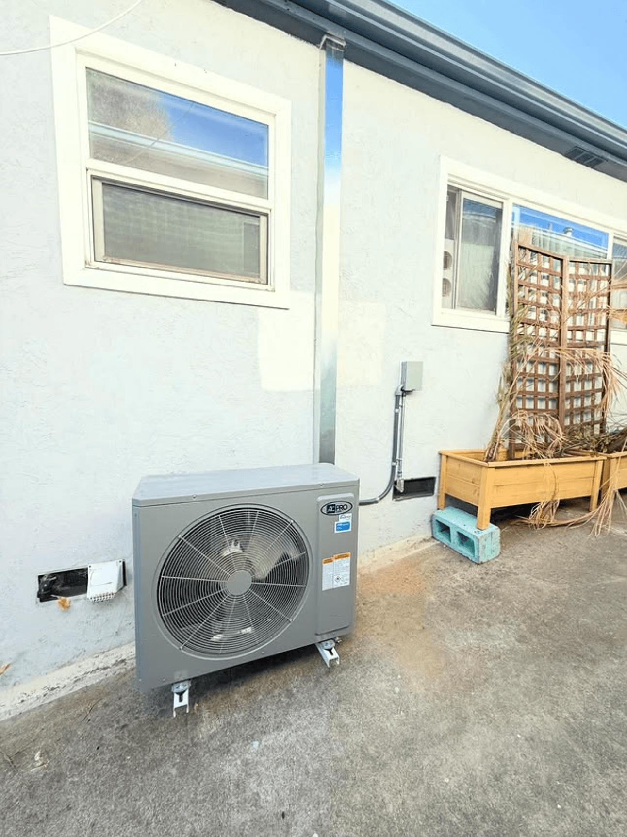 Outdoor AC condenser unit installed at a North County home