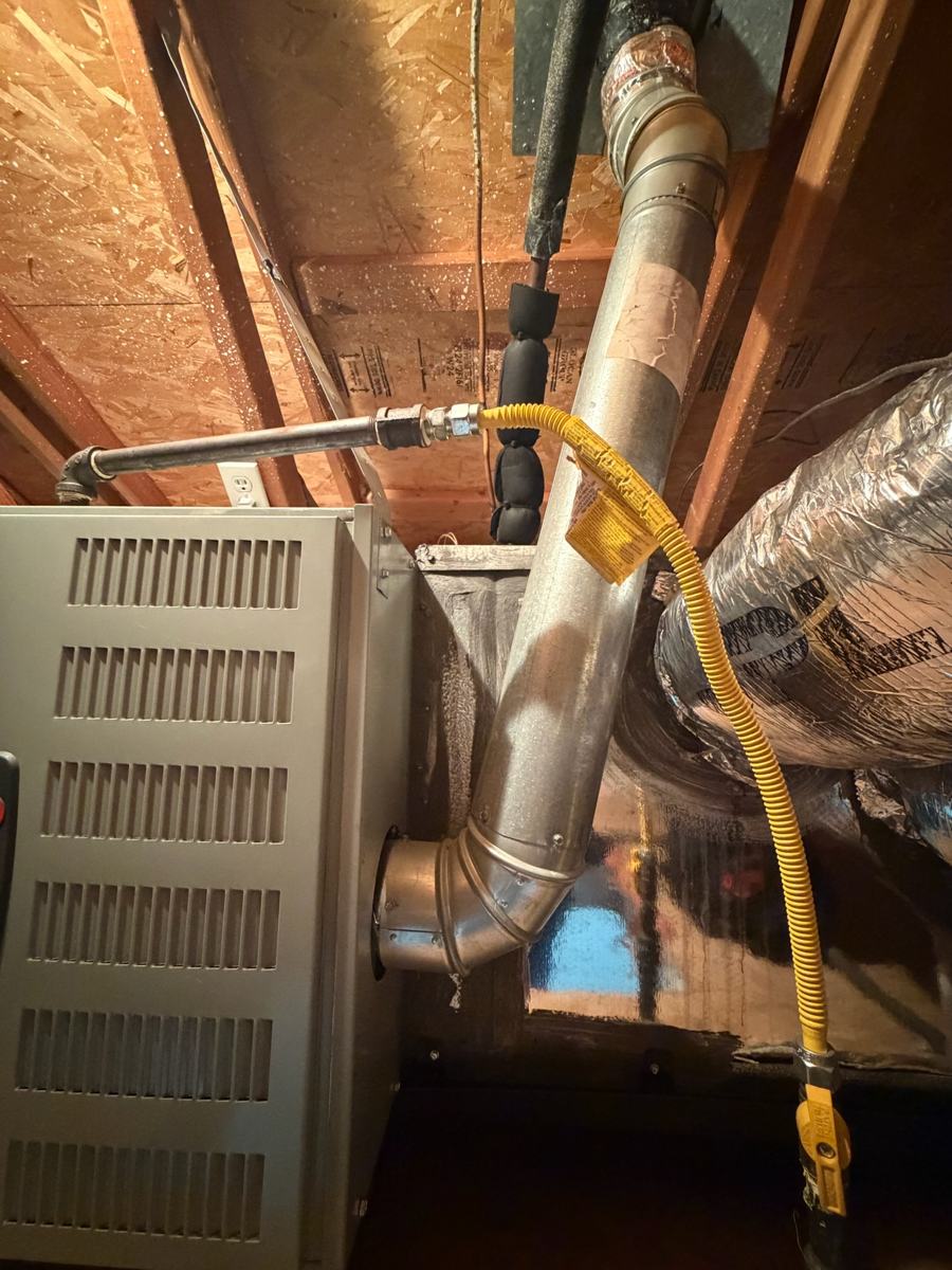 Attic furnace and gas line during a service visit