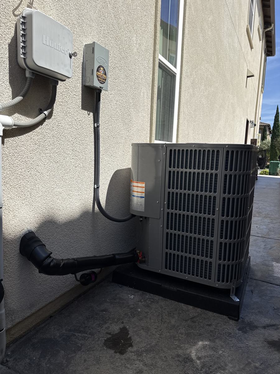 Replacement AC condenser on a new pad in Carlsbad