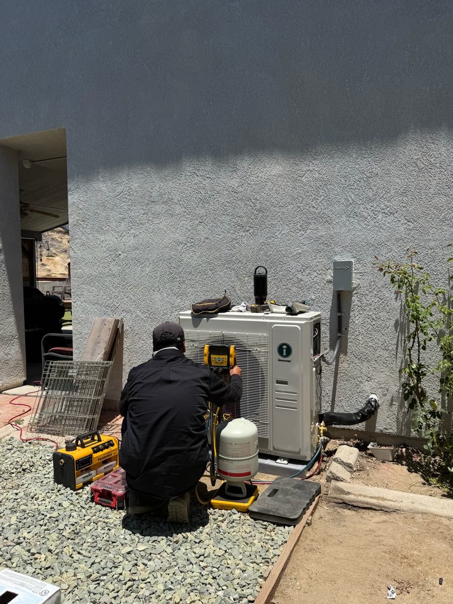 Technician finishing a mini-split install