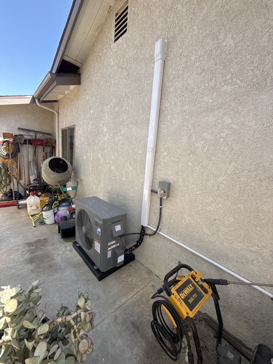 New outdoor unit on a pad in Vista